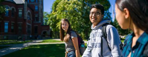 three students walking on campus